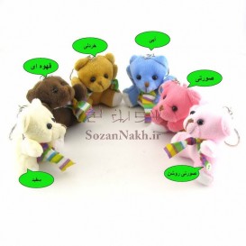 عروسک خرس نشسته با شال گردن راه راهی